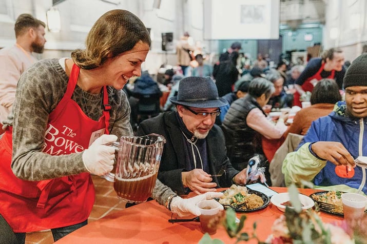Volunteer serving guest at Thanksgiving