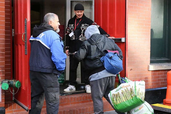 Volunteer welcoming guest