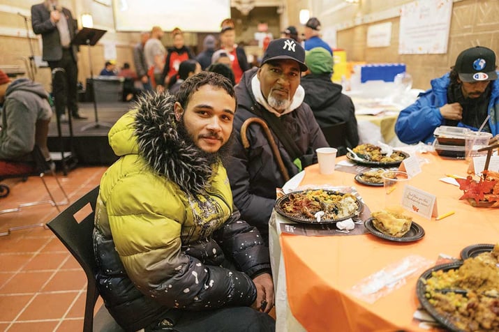 Guests enjoying Thanksgiving meal