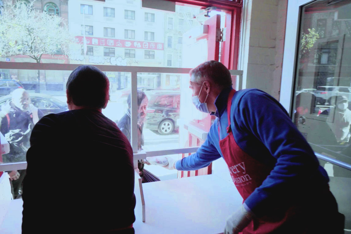 Volunteers serving meals