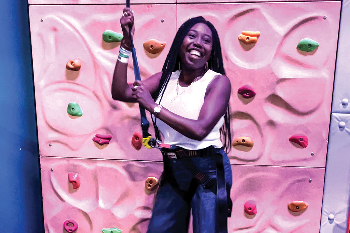 Denise rock climbing