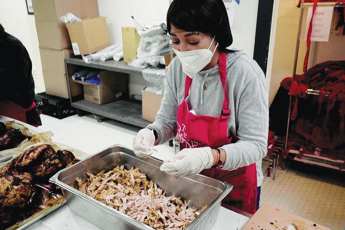 Volunteer prepping food