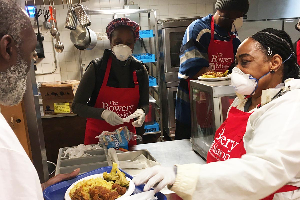 Volunteers serving meals