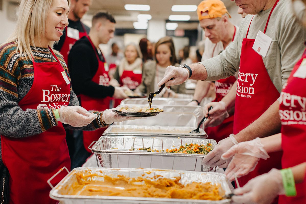 Volunteers serving a meal