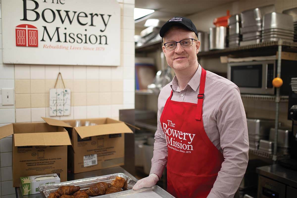 CEO James Winans in a Bowery Mission apron