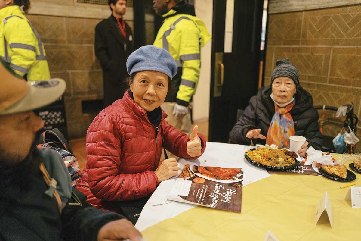 Guest smiling at a table