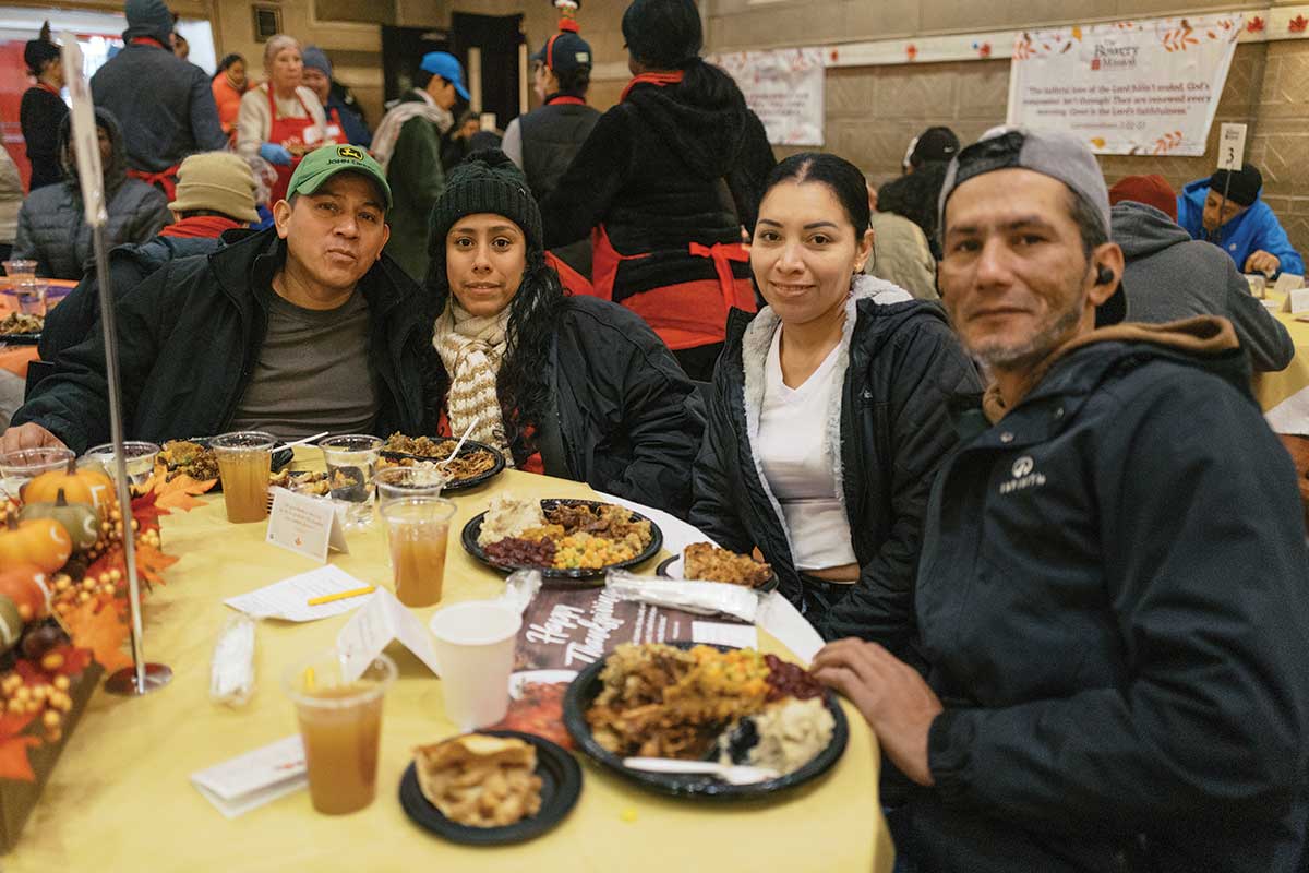 Group of guests smiling on Thanksgiving