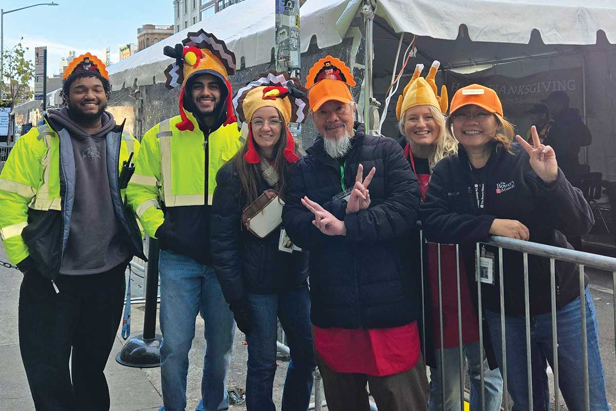 Staff smiling outside The Bowery Mission