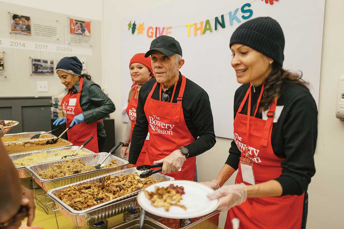 Volunteers serving Thanksgiving dinner