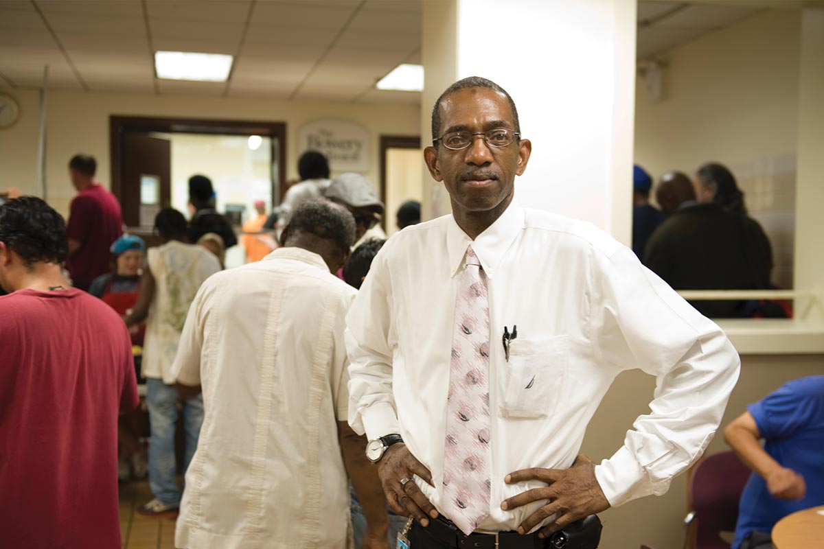Bill standing in The Bowery Mission's dining hall.