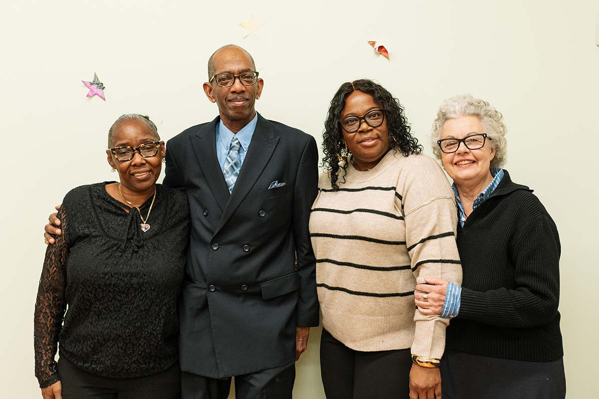 Group photo of staff and alumni at The Bowery Mission's graduation.